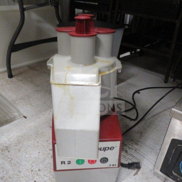 Robot Coupe R2 3 Qt Food Processor, used condition, visible wear. Model R2 featured on base, essential for commercial kitchens.