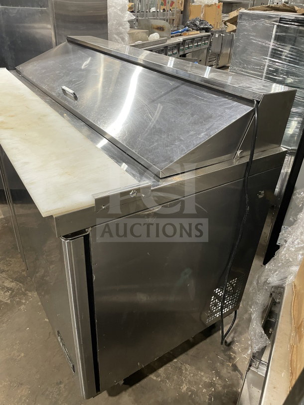 Berg Commercial 60" stainless steel 2-door prep table, model BERGS60. Features poly-coated wired rack, good condition.