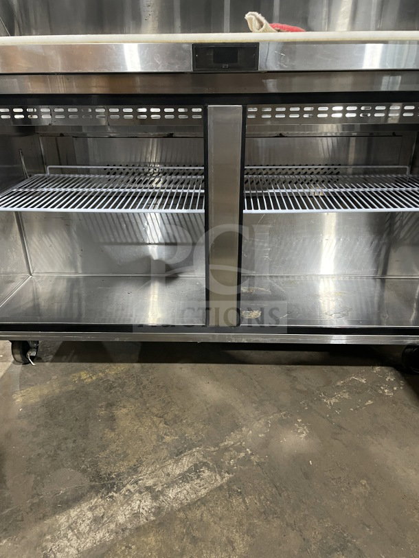 Berg BERGS60 Stainless Steel 60" 2-Door Prep Table with poly-coated rack, solid construction, excellent condition.