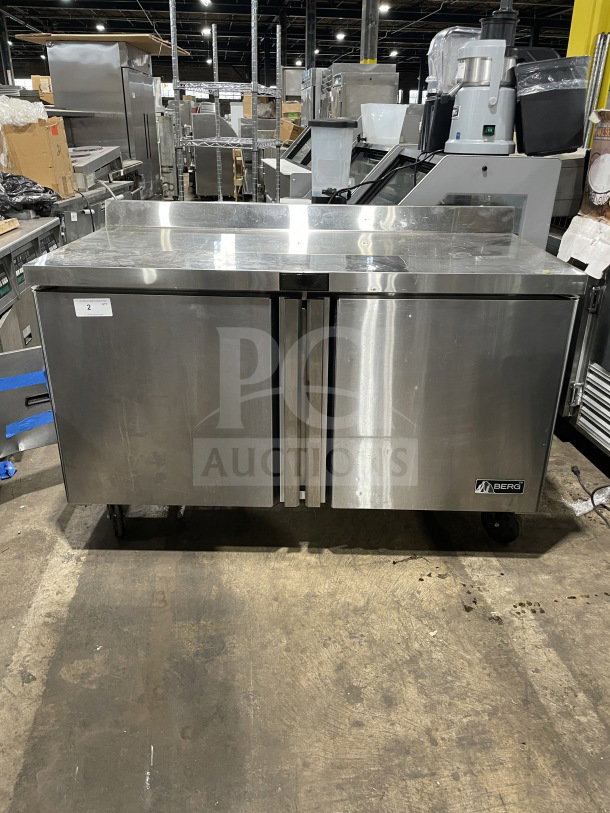 Berg Commercial Stainless Steel 60" Solid 2-Door Prep Table, Model BERWT60R, with poly-coated rack, used condition.