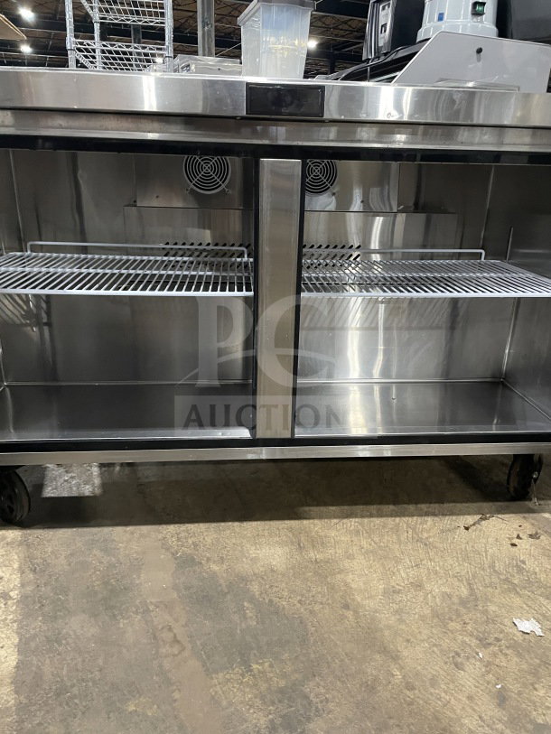 Berg 60" stainless steel 2-door prep table, model BERWT60R, with poly-coated wire rack, commercial use, working condition.