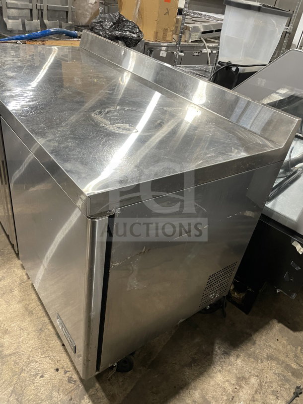 Berg 60" stainless steel 2-door prep table, model BERWT60R, with poly-coated rack. Used, working condition.