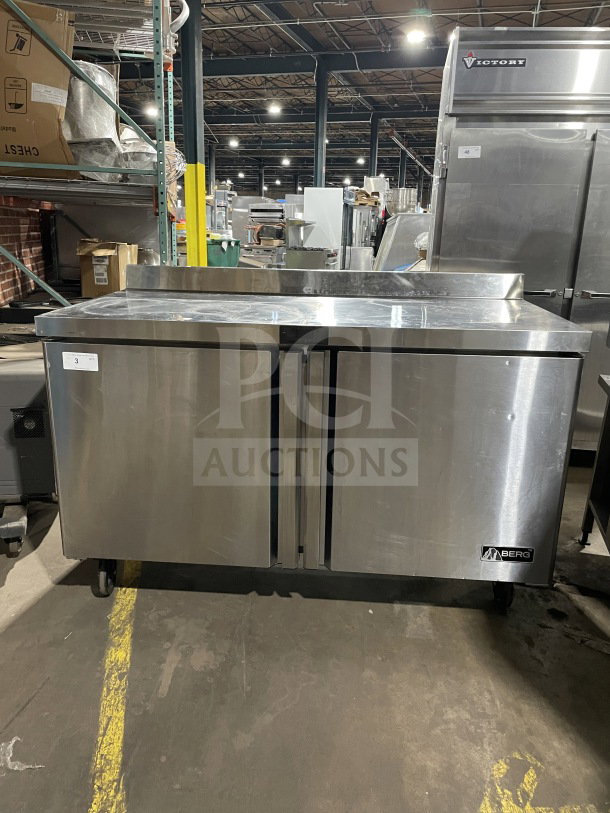 Berg Commercial 60" stainless steel 2-door prep table, Model BERWT60R, with poly-coated wired rack. Good condition.
