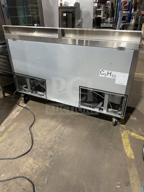 Berg 60" stainless steel 2-door prep table, model BERWT60R, with poly-coated wired rack, good condition, serial number visible.