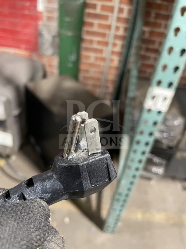 Power plug detail of Berg Commercial Prep Table, Model BERWT60R. Appears intact, suitable for connection.