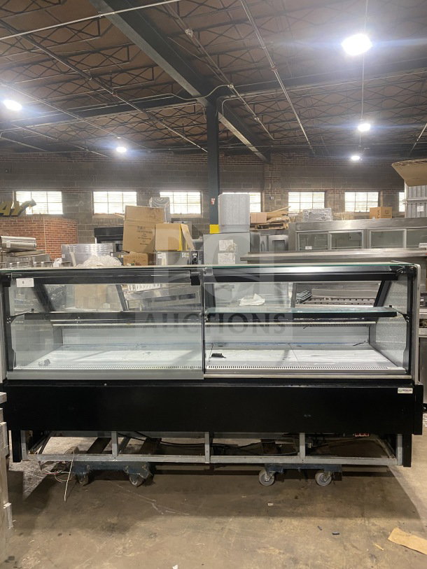 Senkar 2021 NETA8FT sliding door bakery display case, 8ft, black base, clear glass, refrigerated, on casters, model SN: 2004011151.