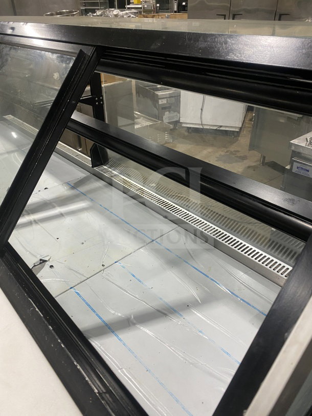 Senkar 2021 Model NETA8FT refrigerated bakery display case, black base, clear glass structure, double compartment, on casters.