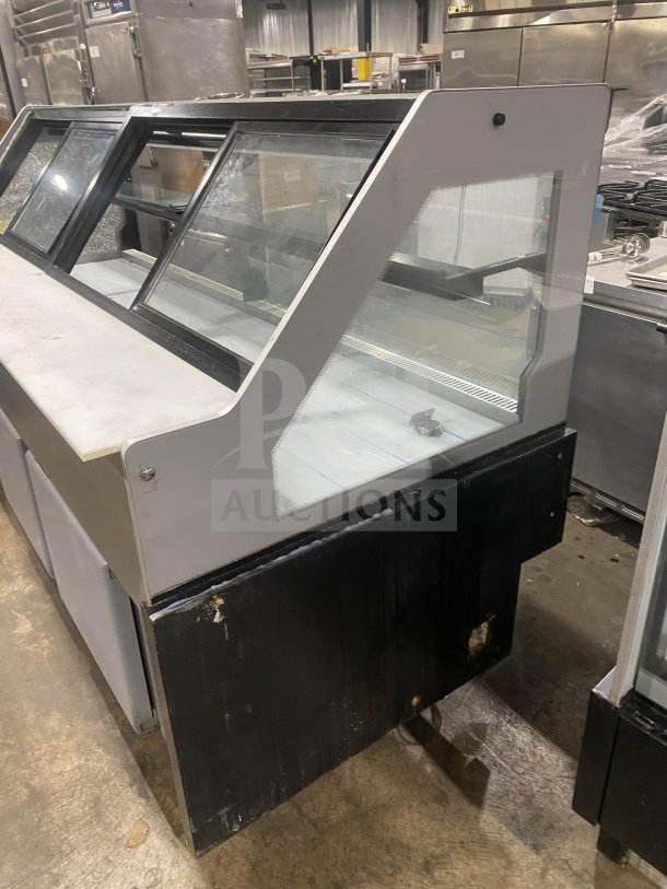 Senkar NETA8FT bakery display case with black base, clear glass, double compartments, and sliding doors; on casters, 110V.