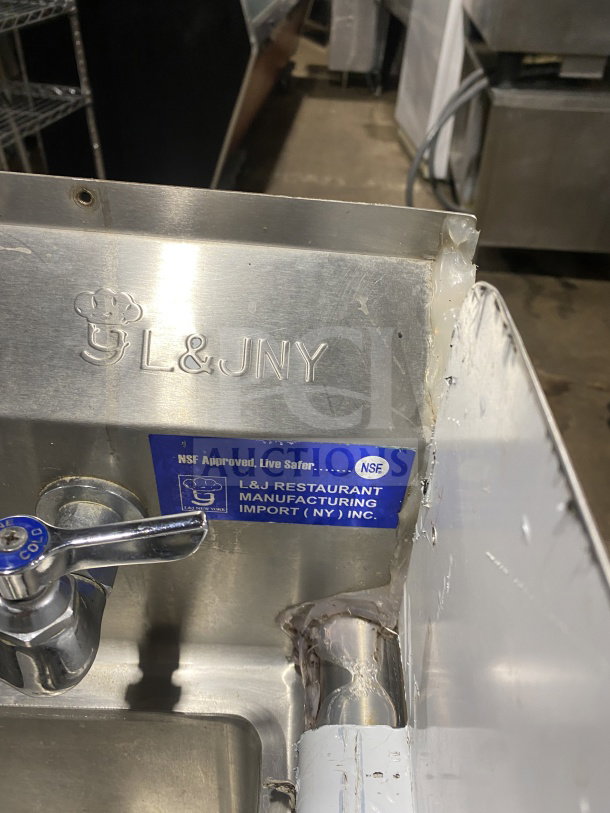 L&J stainless steel hand sink with dual side splashes, splash-mount faucet, and branded label; NSF approved.