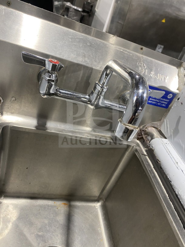 L&J stainless steel hand sink with dual side splashes and splash-mount faucet, on legs, used condition.