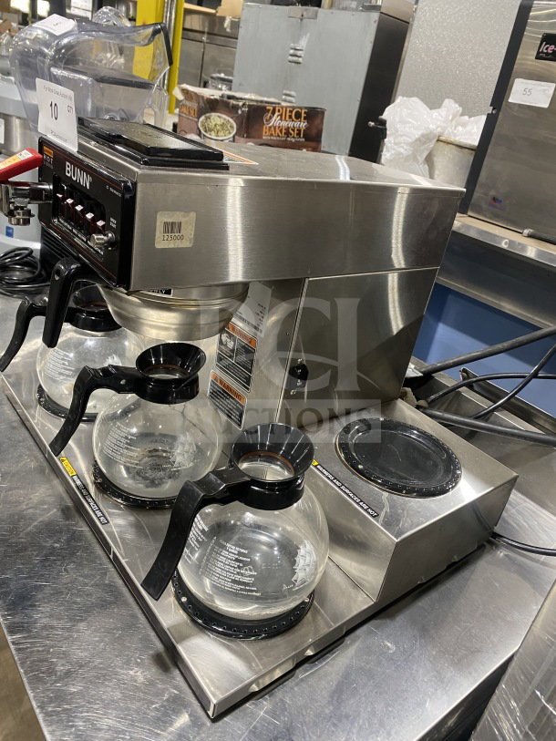 Bunn Commercial Coffee Brewing Machine, stainless steel, model CRTF535, with 5 warming stations, hot water dispenser, 120/240V, on legs.