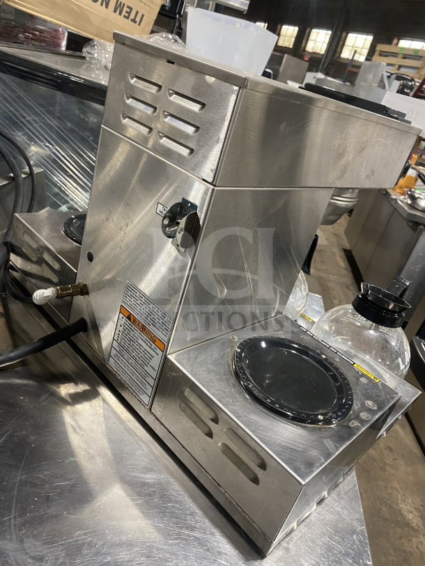 Bunn CRTF535 commercial coffee brewer with 5 warming stations, stainless steel, hot water dispenser, 120/240V, on legs.