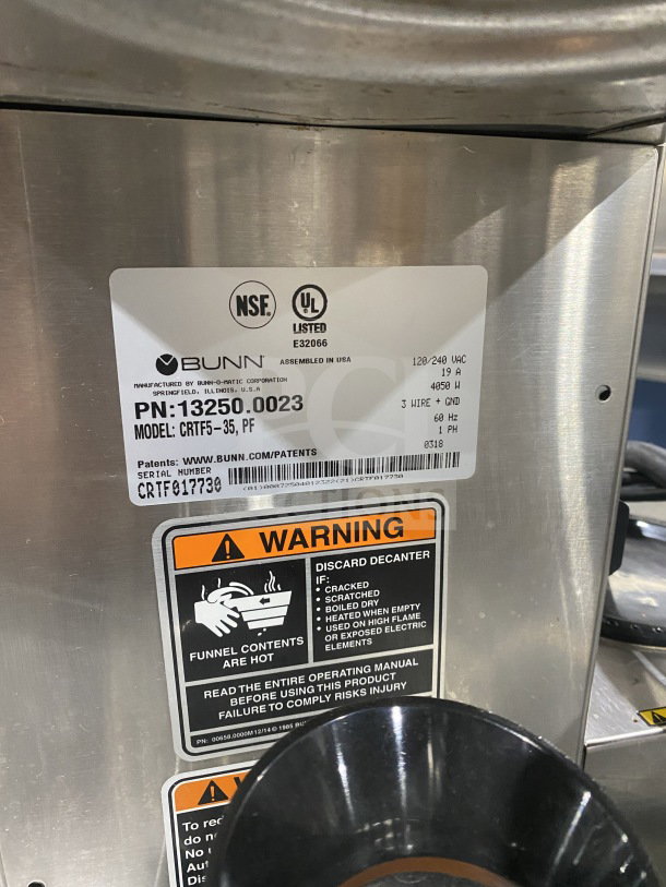 Bunn commercial coffee machine model CRTF535 with 5 warming stations and hot water dispenser. Serial #: CRTF017730.