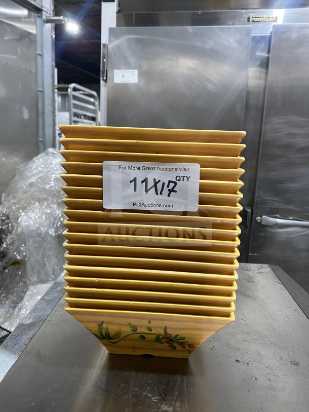 Stack of commercial heavy-duty melamine plates, harvest-yellow, unique angular geometric design, 17 plates total, mint condition.