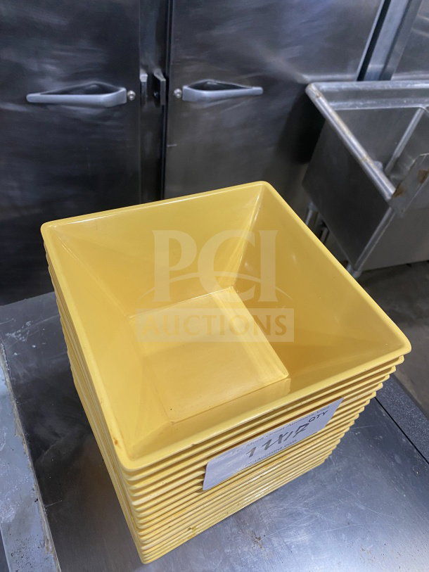 Stack of harvest-yellow commercial heavy-duty melamine plates with unique angular geometric design, labeled with quantity.