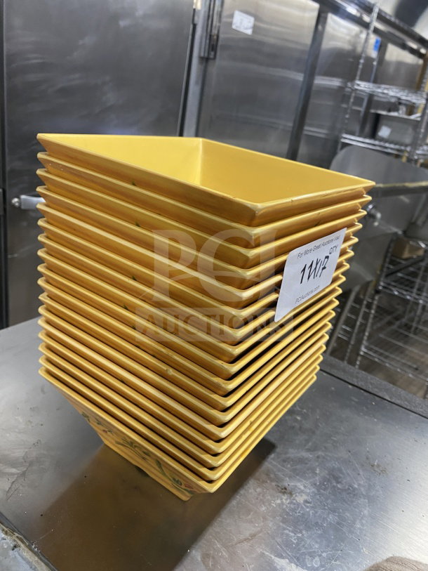 Stack of commercial heavy-duty melamine harvest-yellow plates with unique angular geometric design in excellent condition.