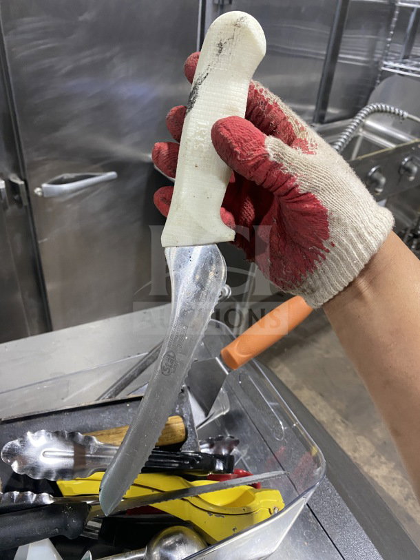Lot of commercial kitchen smallwares, including various prep utensils in used condition. Includes knives, tongs, and more.