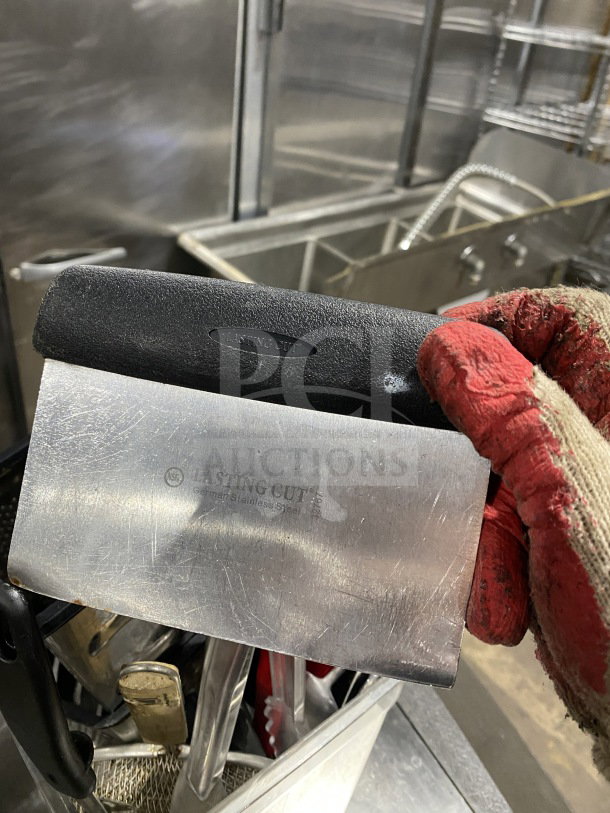Commercial kitchen smallwares and prep utensils lot, featuring a Lasting Cut German stainless steel scraper with visible wear.
