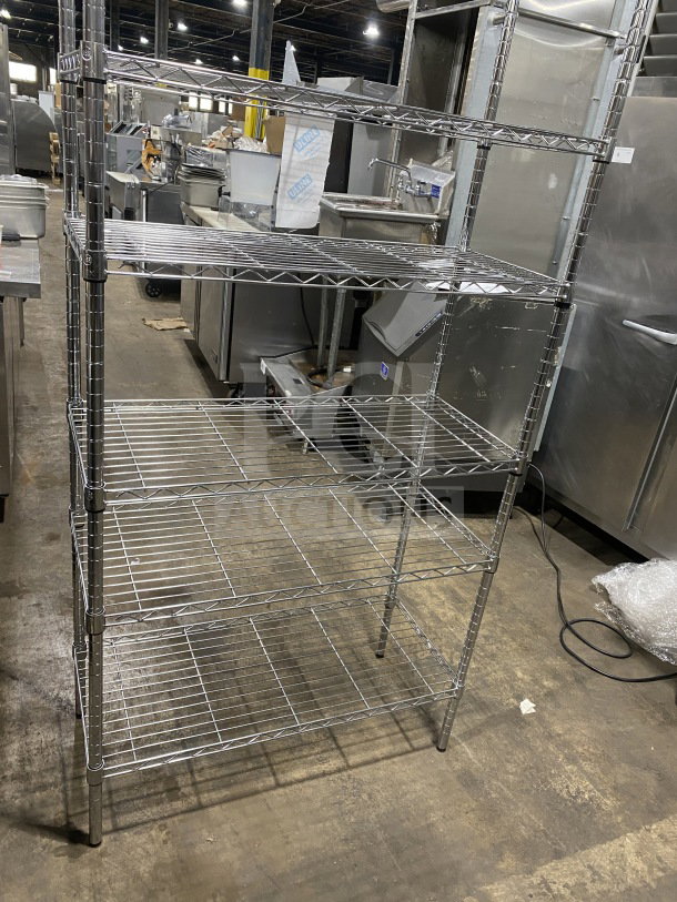 Quantum commercial carbon steel chrome-plated wired shelf, 36x16 inches, five tiers, used condition, durable storage solution.