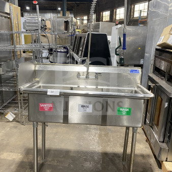 L&J stainless steel 3-bay dishwashing sink with wash, rinse, sanitize labels and dual drain boards on legs.