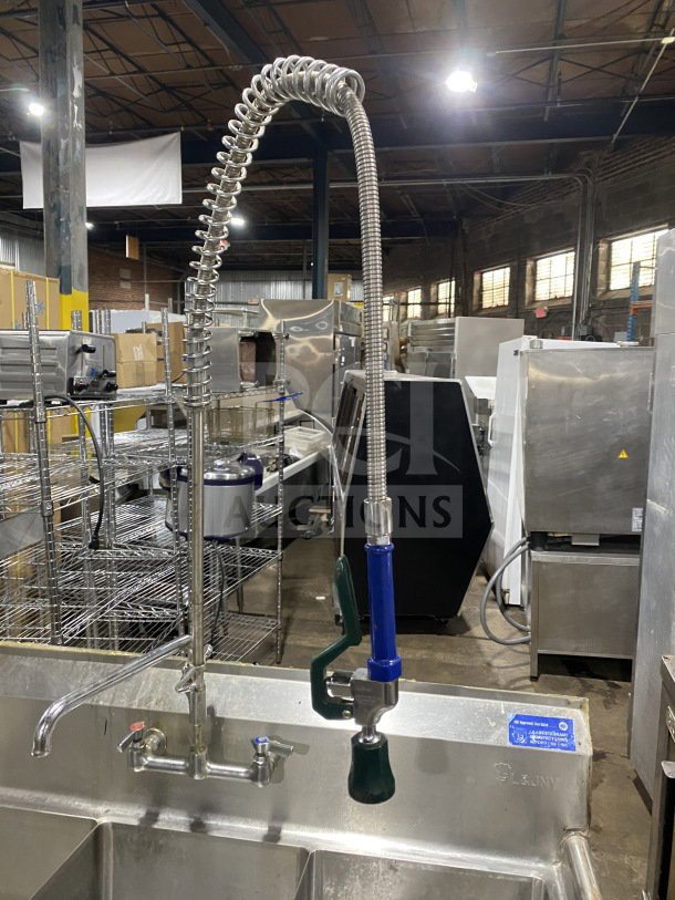 L&J stainless steel 3-bay dishwashing sink with dual drain boards, faucet with sprayer. Ideal for commercial use.