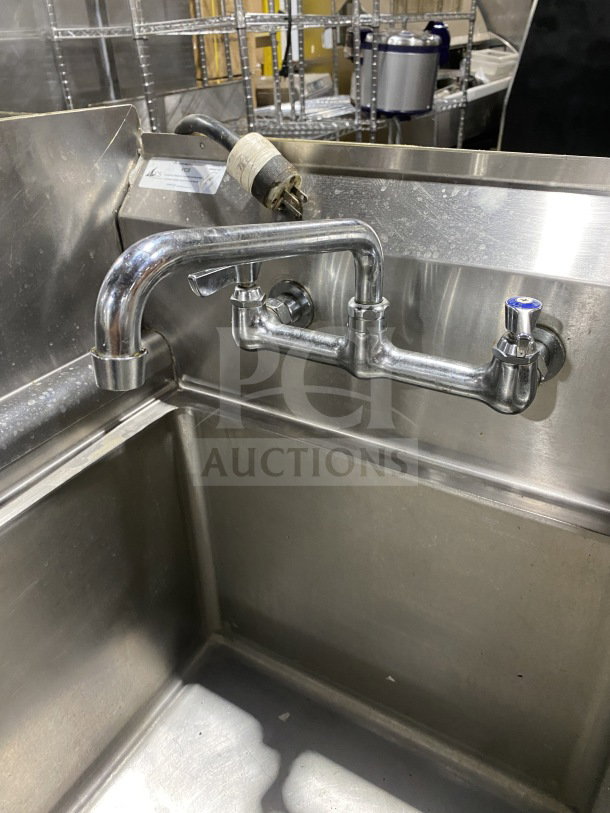 KCS stainless steel 1-compartment prep sink with integrated garbage disposal, splash-mount faucet, and legs.