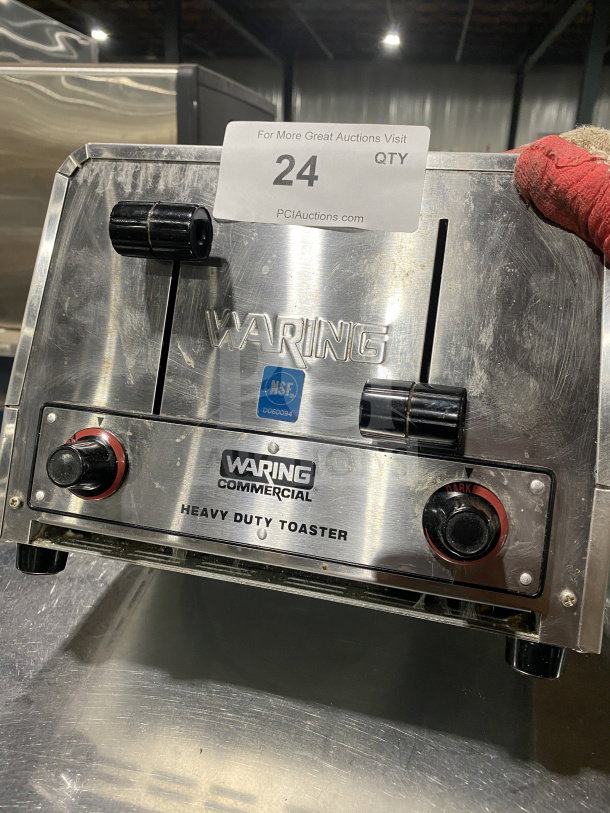 Waring Commercial WCT800 4-slice toaster, stainless steel, heavy-duty, on legs. Visible NSF label and auction tag.