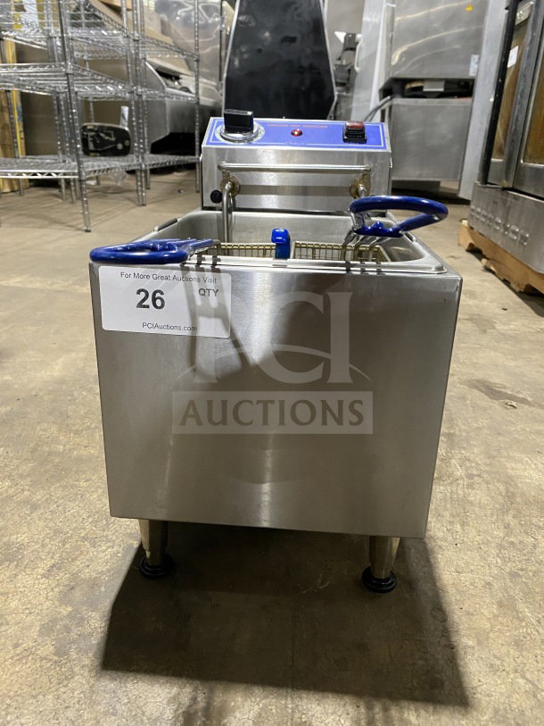 Globe PF16E stainless steel countertop electric fryer, with frying basket and backsplash, on legs, 2024 model, 208/240V.