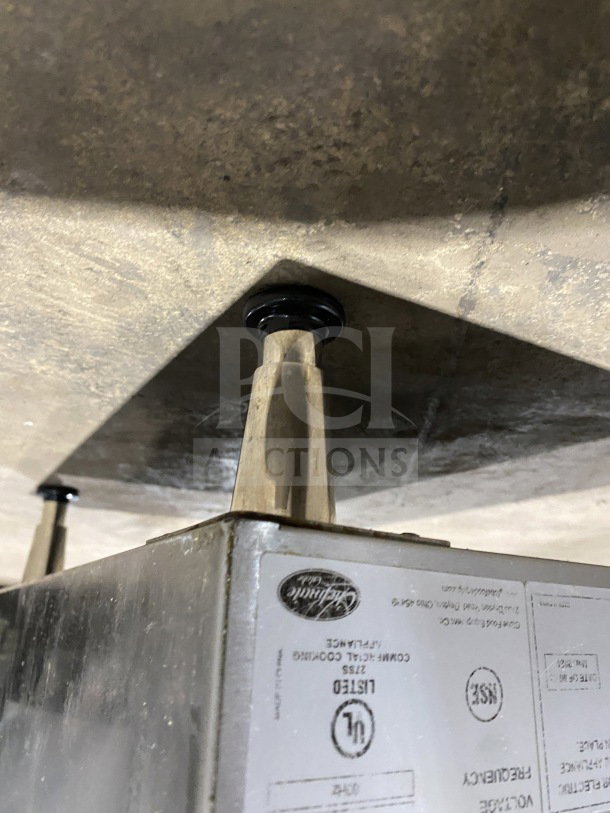 Globe PF16E stainless steel electric countertop deep fryer with basket, backsplash, on legs. 208/240V. Model tag visible.