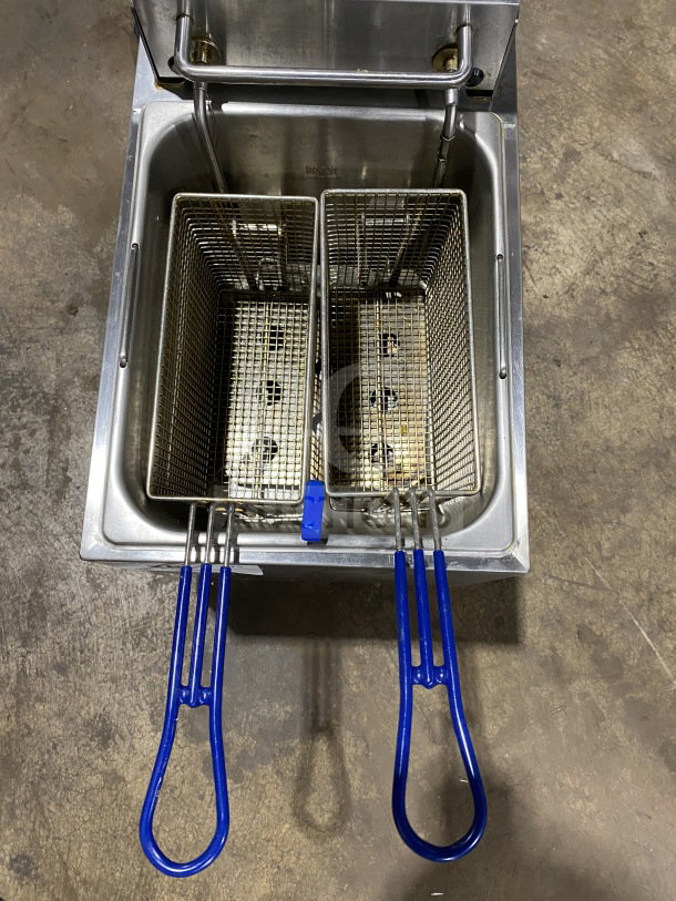 Globe PF16E electric deep fryer, stainless steel, with dual frying baskets, backsplash, and legs. Working condition.