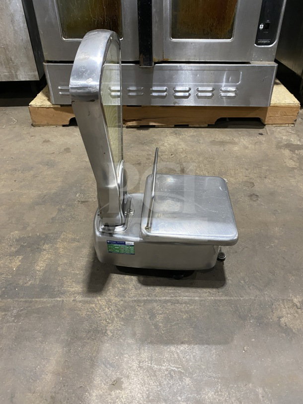 Commercial stainless steel mechanical computing fan scale, working condition, features digital display and sturdy platform.