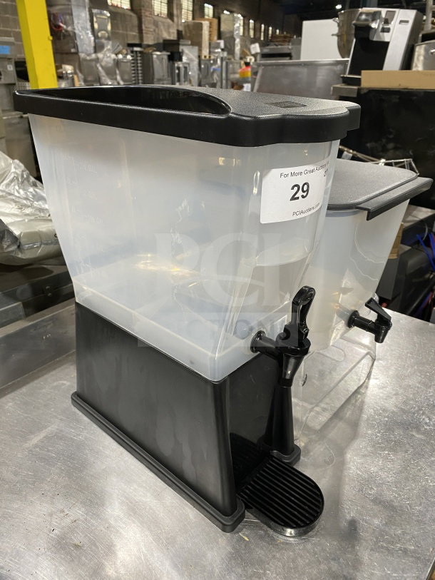Commercial plastic cold beverage dispenser combo with black base and tap, alongside separate clear dispenser reservoir, shown in industrial setting.