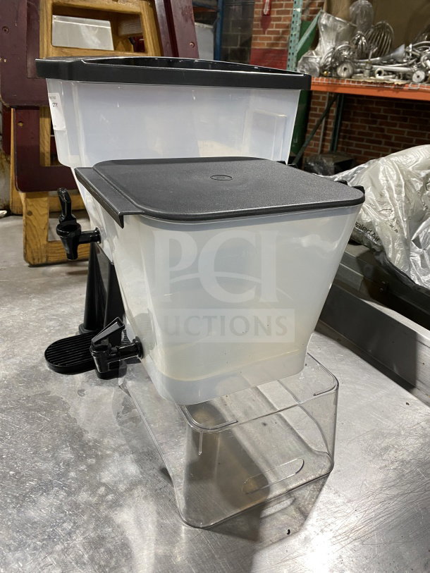 Commercial plastic cold beverage dispenser combo with black lids; includes a stacked clear plastic reservoir.