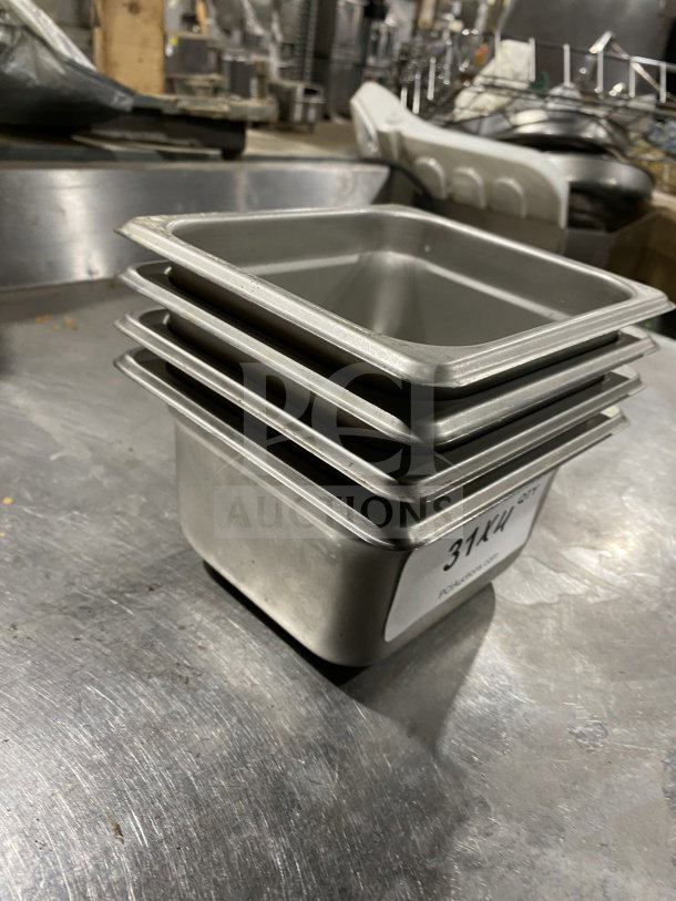 Winco SPJL-604 stainless steel half-size anti-jam hotel pan, stack of four, in good condition. Label reads "314/KW".
