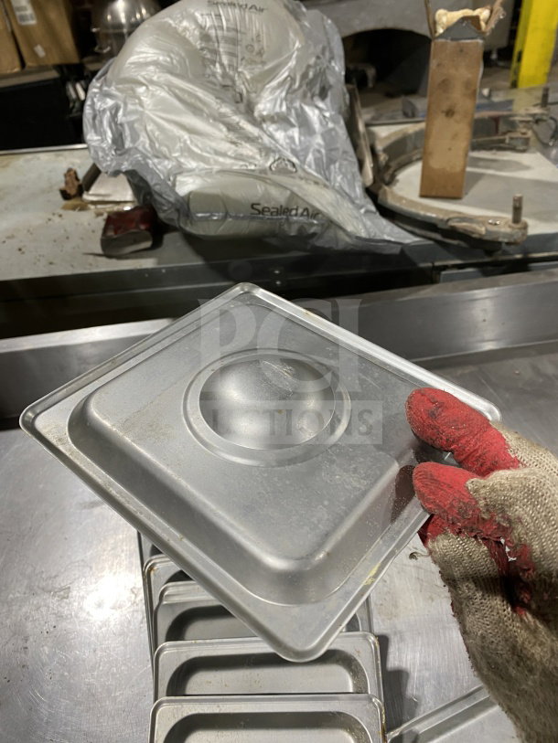 Winco Commercial Stainless Steel 1/6 Pan Lid, Model SPSCS, visible wear, part of a lot auction, SN: 11294400830.