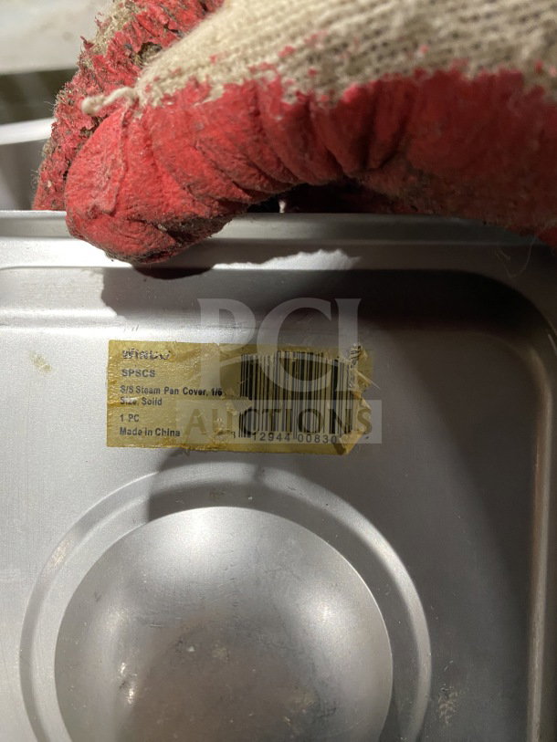Winco SPSCS stainless steel 1/6 pan lid, commercial grade, model 11294400830, fair condition, tag shows model and barcode.