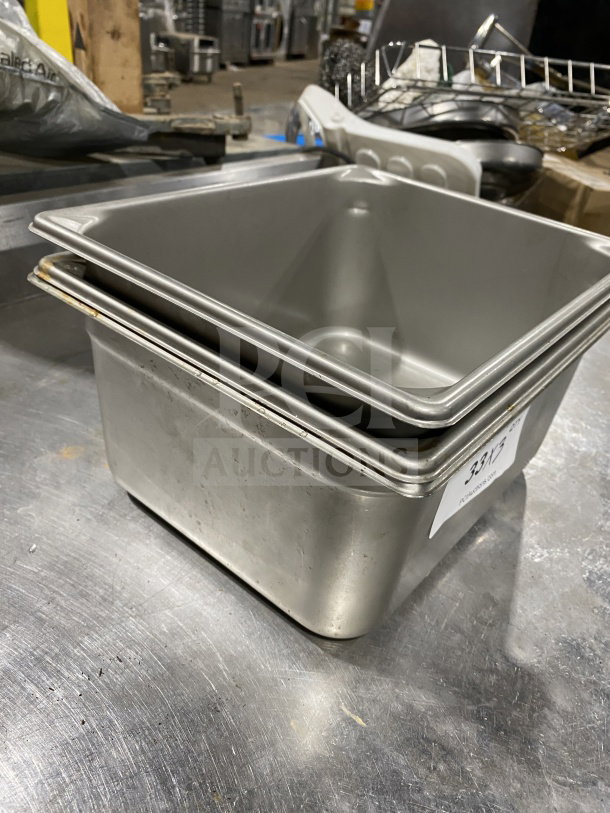 Vollrath half-size stainless steel steam pan, model 30262, commercial grade, visible scratches, auction tag attached.