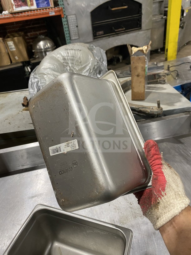Winco SPJM406 stainless steel quarter-size steam pan, used condition, visible label. Great for commercial kitchens.