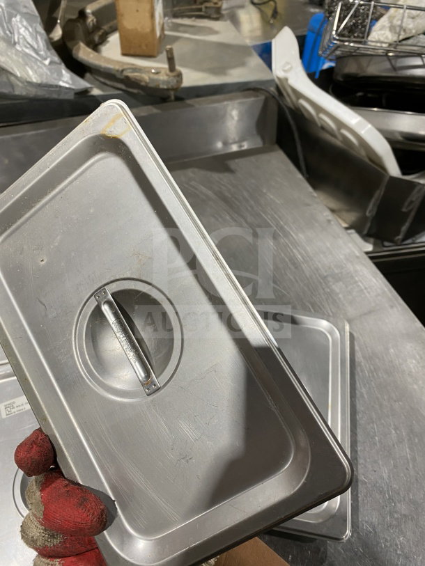 Winco SPSCQ stainless steel steam table pan cover, 1/4-size, recessed handle, used condition with visible wear.
