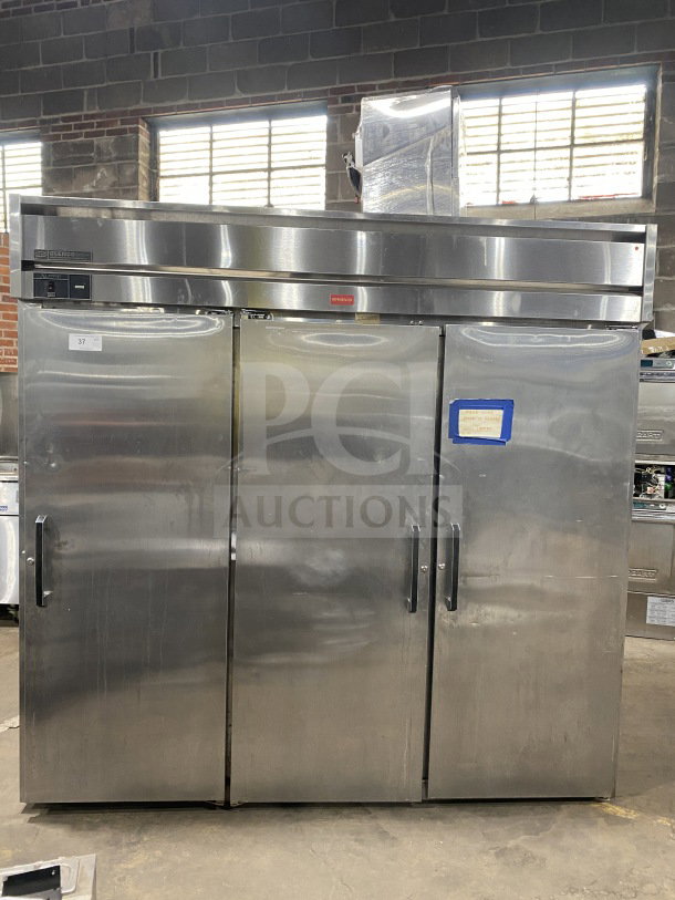 Glenco XL Series EB 3-door stainless steel reach-in refrigerator, Model SLS74TE, with chrome plated wire rack, 115V, working condition.