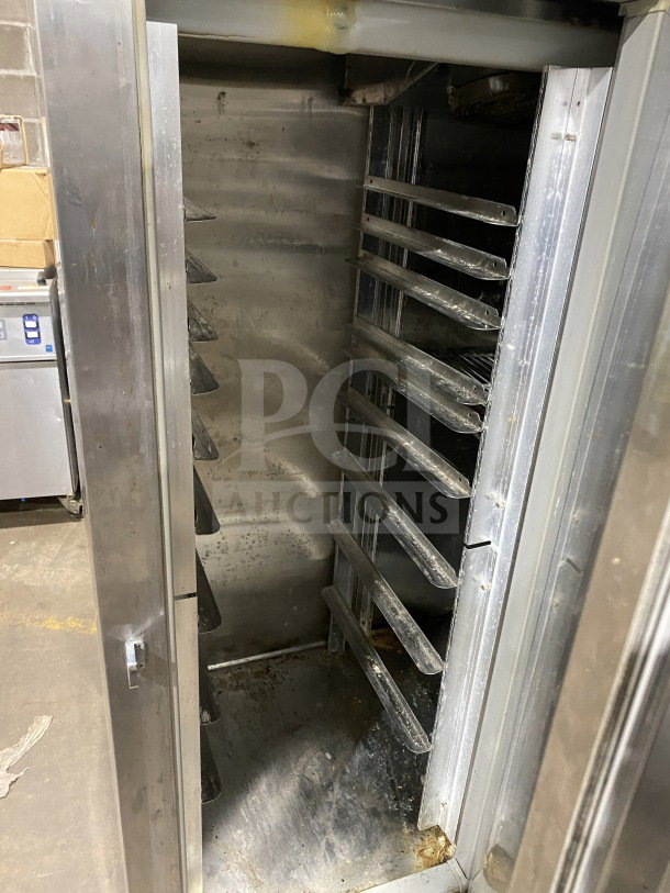 Glenco XL Series EB stainless steel 3-door reach-in refrigerator, Model SLS74TE, with chrome wire rack. Working condition.