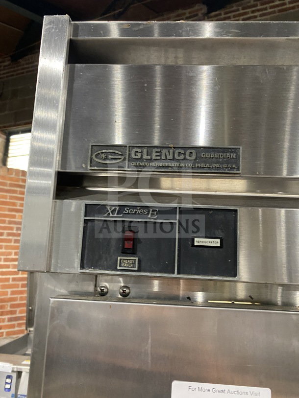Glenco XL Series EB stainless steel 3-door reach-in refrigerator, model SLS74TE, with a chrome plated wire rack.