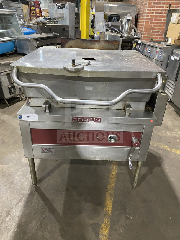 Crown Commercial Stainless Steel 30 Gal. Gas Steam Tilt Skillet, Model GS-30, with open base, strainer, measurement marks, on legs.