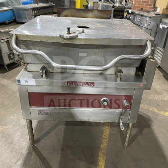 Crown Commercial Stainless Steel 30 Gal. Gas Steam Tilt Skillet, Model GS-30, with open base, strainer, measurement marks, on legs.