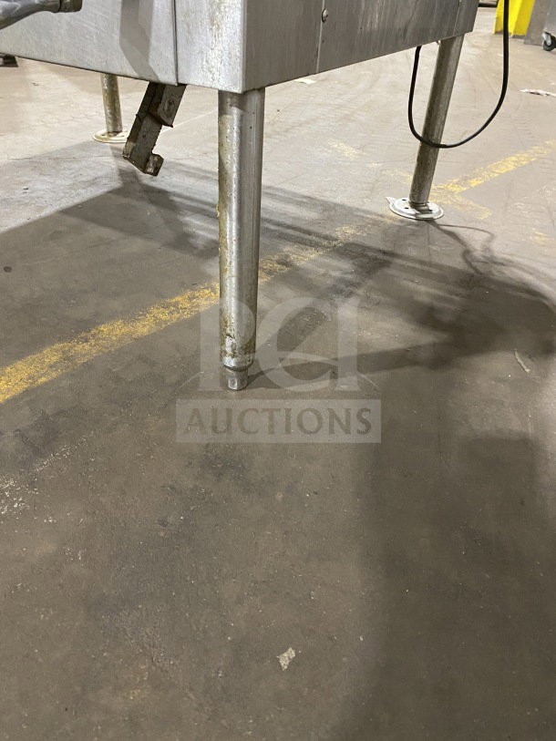 Crown GS-30 stainless steel 30-gal steam tilt skillet on legs, natural gas, strainer, measurement marks, open base.