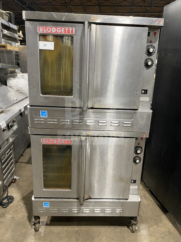 Blodgett stainless steel double stacked convection oven, gas-powered, Energy Star certified, with wired rack, on casters.