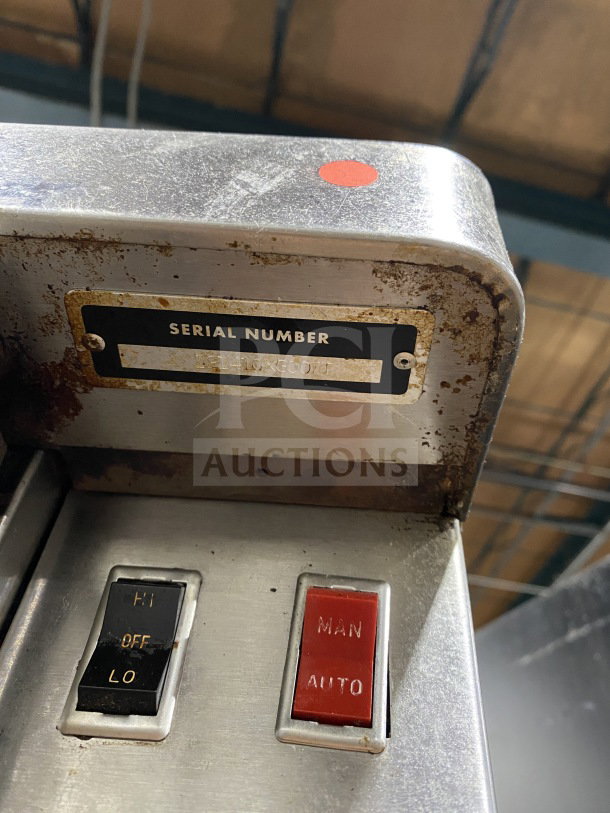 Blodgett commercial stainless steel convection oven controls with serial number label. Features manual and auto switches.