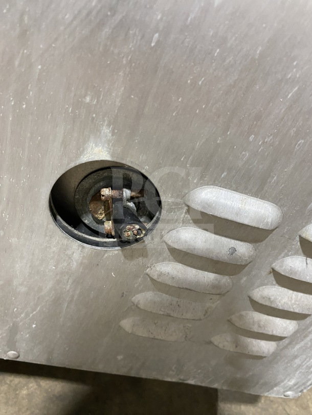 Close-up of the Metro H2 2000 Series C175HM2000 stainless steel cabinet vent, showing rust and wear on heating element.
