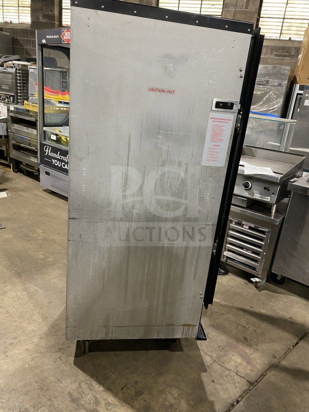 Metro H2 2000 Series stainless steel heated holding cabinet, model C175HM2000. "Caution: Hot" label visible. On wheels.