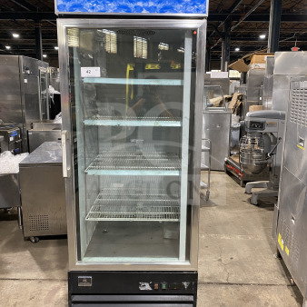 Kelvinator Commercial 28" display freezer, model KCGM24FB, with bottom mount compressor, poly-coated rack, on casters.
